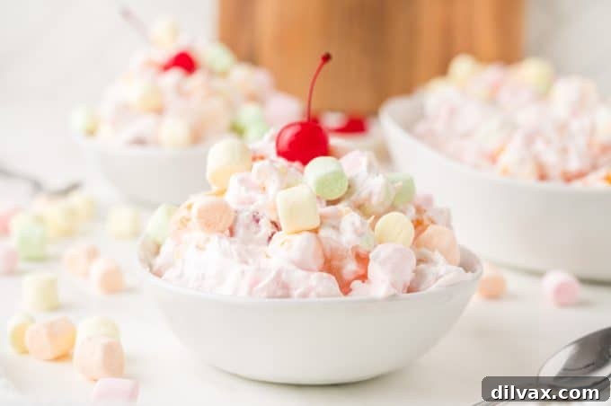 Ambrosia Salad - Fluffy, creamy fruit salad with marshmallows and cherries.