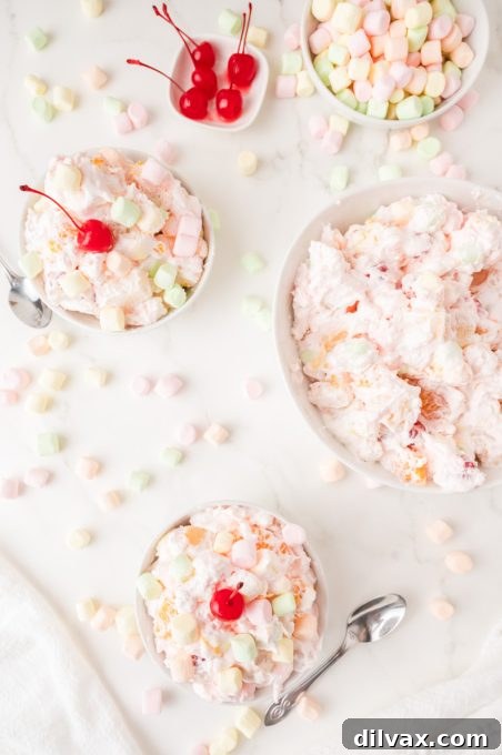 Fluffy dessert salad in a glass bowl.