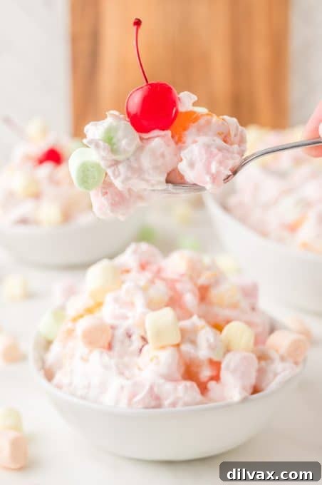 A spoonful of creamy Southern fruit salad, Ambrosia.