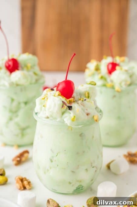 A side salad made with Cool Whip and pistachio pudding.