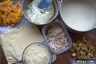 Ricotta cheese mixture in a bowl, ready for lasagna assembly