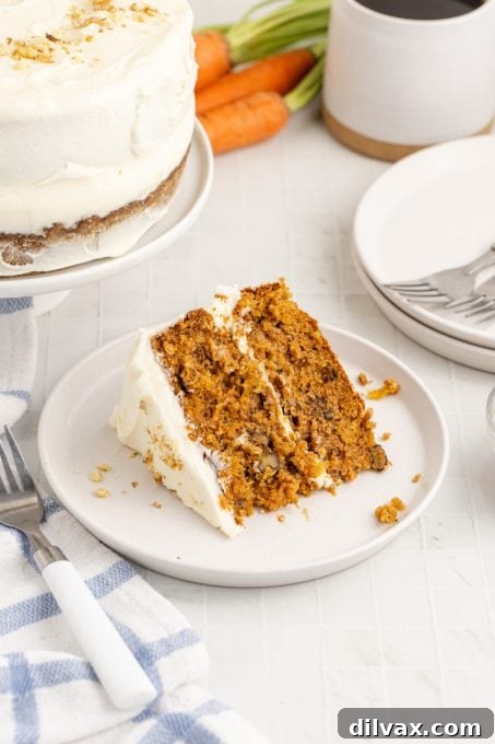 Cream cheese frosted carrot cake with pineapple, ready for enjoyment.