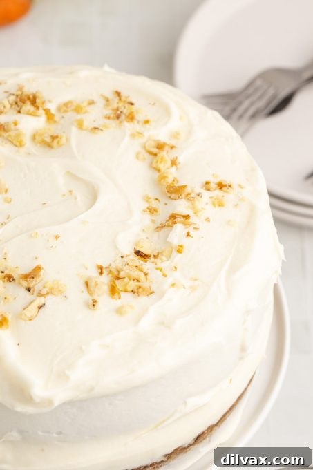 Walnuts on top of a delicious cake made with carrots and pineapple.