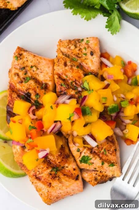 Flame-Kissed Salmon with Zesty Mango Salsa 7 A tropical fruit salsa tops salmon that's been prepared on the grill.