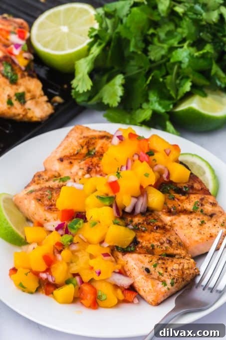 Flame-Kissed Salmon with Zesty Mango Salsa 8 Salmon cooked on the grill with a mango tropical salsa.