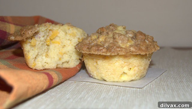 Delicious Peach Streusel Muffins with fresh peaches and a golden cinnamon streusel topping, perfect for any summer breakfast or special brunch.