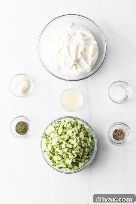 Effortless Greek Tzatziki Dip 4 Ingredients laid out for making Easy Tzatziki Sauce.