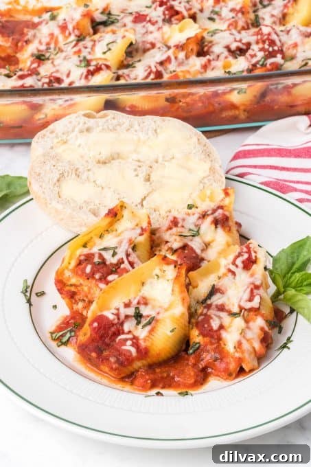 A plate of Chicken Parmesan Stuffed Shells with parsley garnish