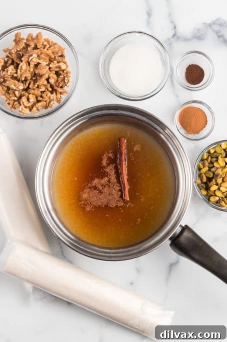 Preparing the honey-lemon syrup in a saucepan to pour over baked Baklava