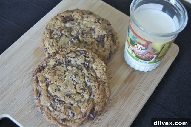 Guilt-Free NY Times Chocolate Chip Cookies 2 Freshly baked chocolate chip cookies cooling on a wire rack.