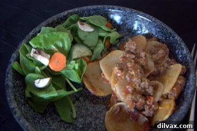 The baked potato beef casserole, golden brown on top, freshly out of the oven.