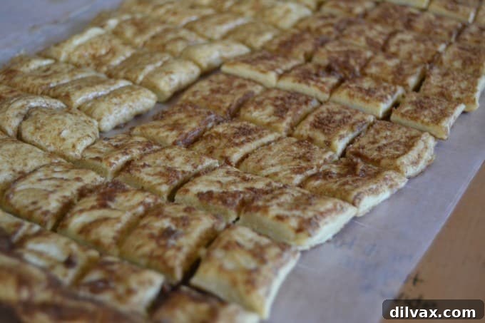 Close-up of Pepperidge Farm Sweet Roll dough being cut into 1-inch pieces using a pizza cutter