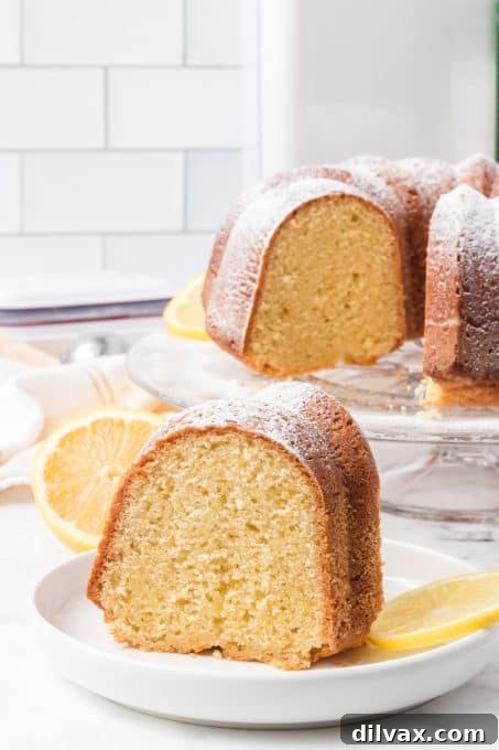 A delightful Bundt cake made with olive oil and lemon, garnished with powdered sugar.