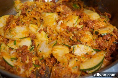 Spicy Chorizo Zucchini Fettuccine 3 Cooked chorizo and zucchini mixture in a skillet.