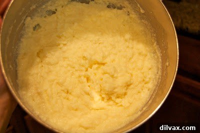 Spicy Chorizo Zucchini Fettuccine 4 Mixing eggs, ricotta cheese, and Parmesan cheese in a bowl.