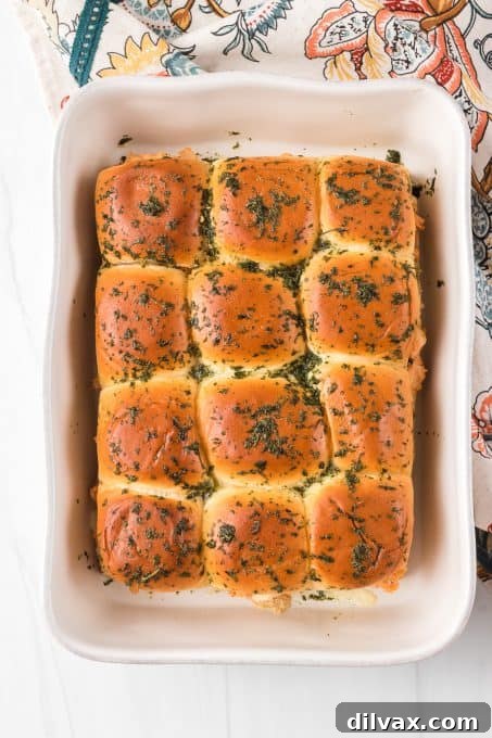 Fiery Buffalo Chicken Sliders 7 A batch of hot and cheesy Buffalo Chicken Sliders on a serving platter.