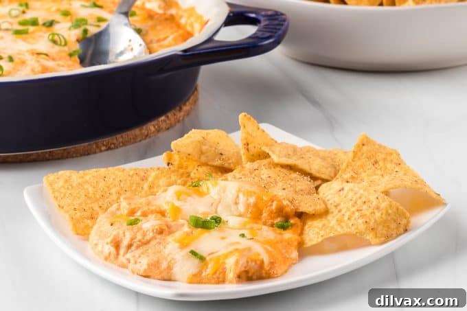 Protein-Packed Cottage Cheese Buffalo Chicken Dip 2 Creamy Cottage Cheese Buffalo Chicken Dip served in a baking dish with dippers