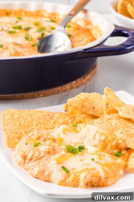 Protein-Packed Cottage Cheese Buffalo Chicken Dip 8 A close-up of Cottage Cheese Buffalo Chicken Dip garnished with green onions.