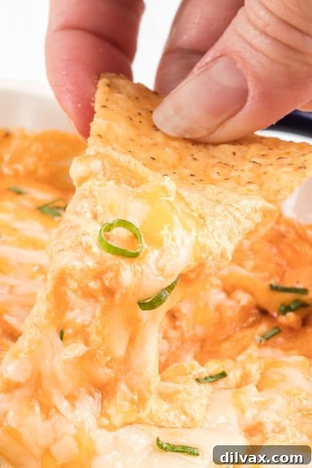 Overhead shot of a bubbling Cottage Cheese Buffalo Chicken Dip in a skillet.