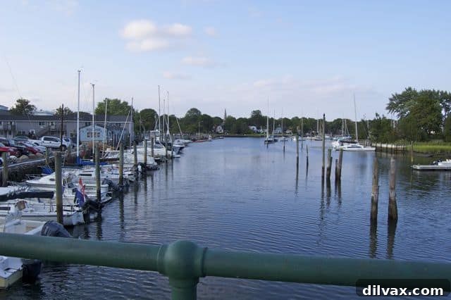 A tranquil beach scene with sand, water, and distant land