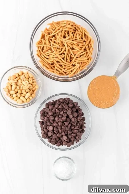 Golden Stacks 4 All five simple ingredients for making Haystacks cookies laid out on a table.