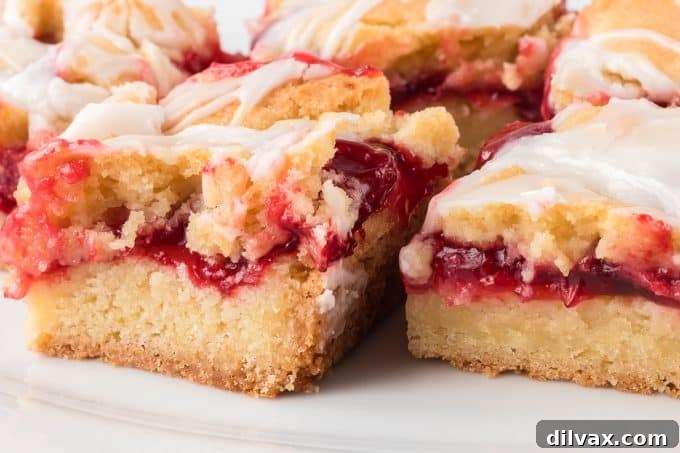 Cherry filling visible in a sliced pie bar
