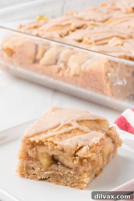 Apple Crumble Bars 11 Easy Pie Bars with apple pie filling and a spiced glaze, served on a platter.