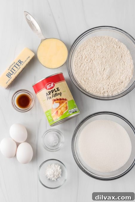 Apple Crumble Bars 4 Ingredients for Apple Pie Bars displayed on a counter.