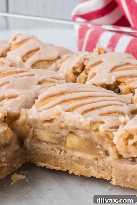 Apple Crumble Bars 9 Close-up of a single Apple Pie Bar with glaze.