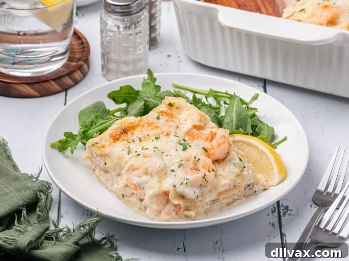 Oceanic Lasagna 2 Decadent Seafood Lasagna, brimming with crab and shrimp, coated in a creamy bechamel sauce, ready to be served.