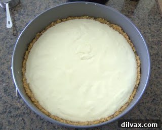 Creamy cheesecake filling poured into the crust.