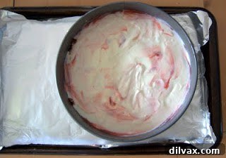 Close-up of the cheesecake's topping layers before final bake.