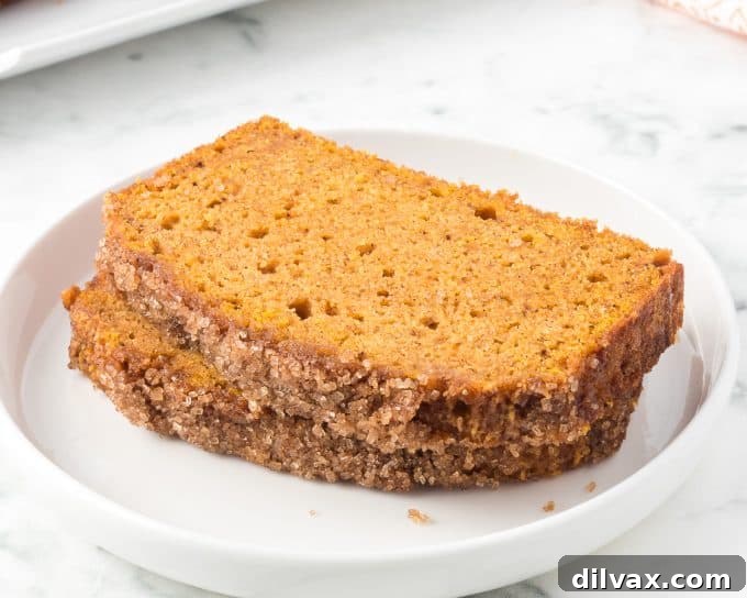 Deliciously Spiced Pumpkin Bread 2 Freshly baked pumpkin bread loaf, ready to be sliced.