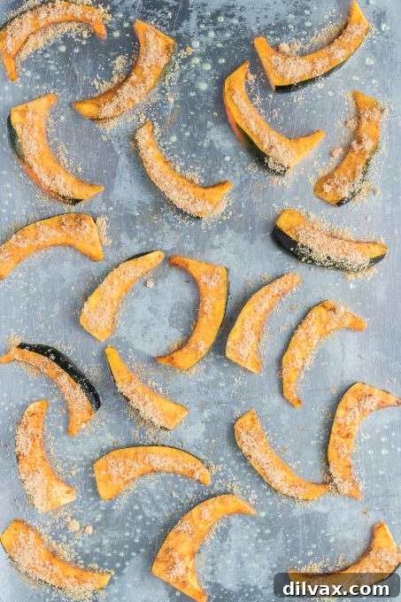 Acorn squash sprinkled with brown sugar and ready for the oven.