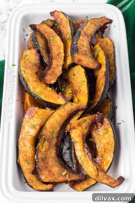 Acorn squash tossed with warm spices and sprinkled with brown sugar.