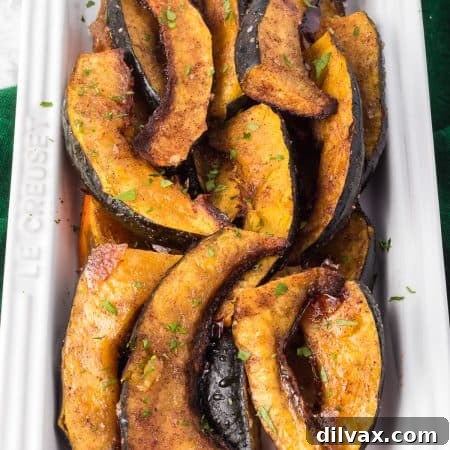 Acorn squash tossed with warm spices and sprinkled with brown sugar.