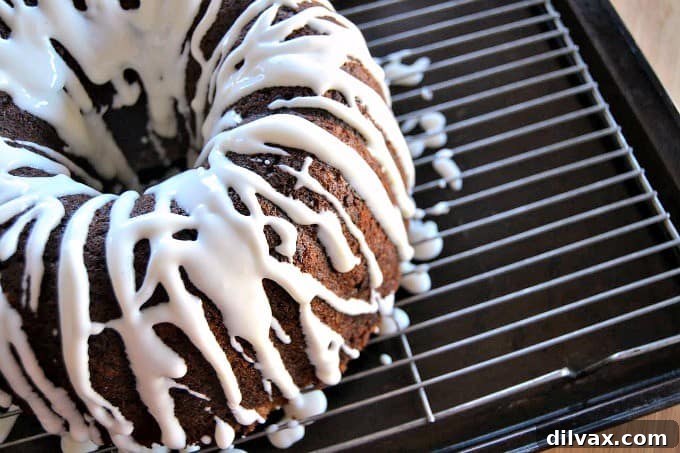 A moist delicious banana bundt cake filled with mini chocolate chips and drizzled with a cream cheese frosting!