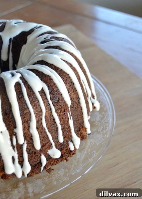A moist delicious banana bundt cake filled with mini chocolate chips and drizzled with a cream cheese frosting!