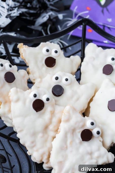Close-up of Halloween Ghosts Rice Krispie Treats with candy eyes and chocolate mouths