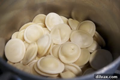 Baked Ravioli Bliss and a Shopping Spree 4 Drained ravioli in a pot, ready for sauce