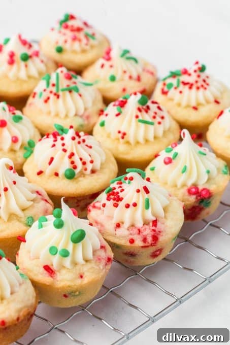 Yuletide Cookie Cups 8 Two hands holding a Holiday Sugar Cookie Cup with red and green sprinkles
