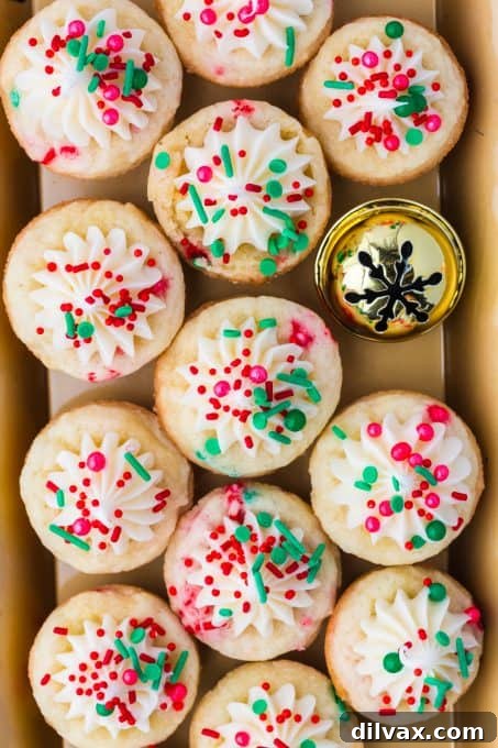Yuletide Cookie Delights 10 Close-up of a single Sugar Cookie Cup with Christmas sprinkles and frosting, highlighting its festive appearance.