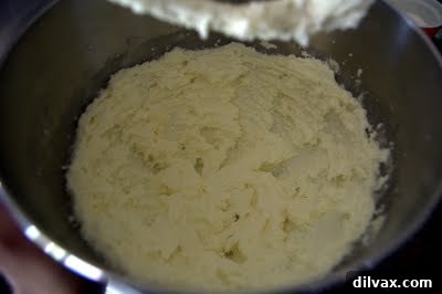 Creamed butter and sugar mixture, showing a pale yellow, airy consistency.