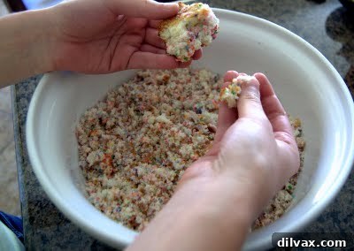 Crumble cake in a large mixing bowl, ready for mixing.