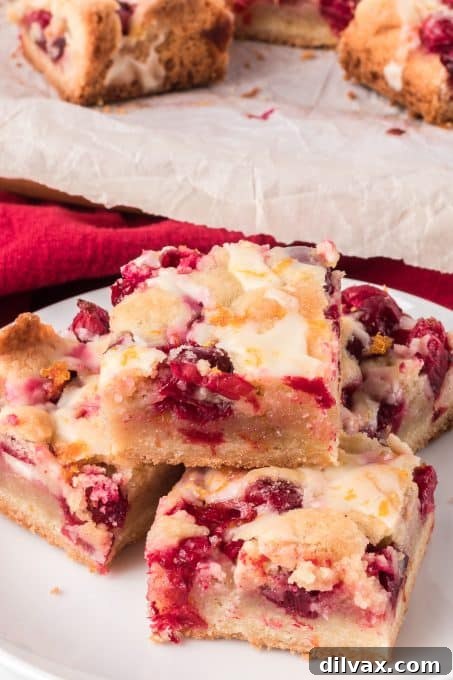 Pie Bars with cranberries and topped with an orange glaze.