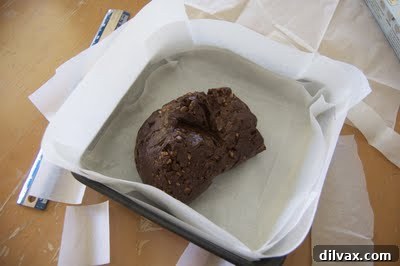 Brownie batter smoothed evenly in the pan