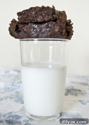 Close-up of a brownie with melted chocolate, toffee, and caramel