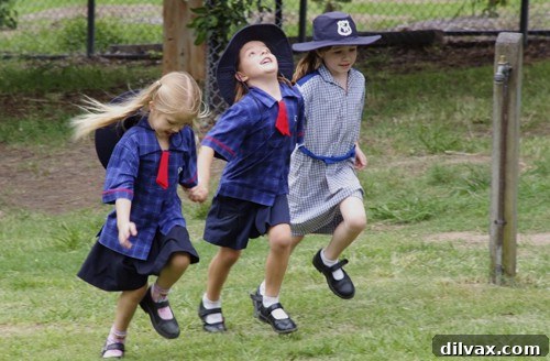 Two joyful girls skipping hand-in-hand