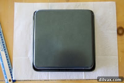 Baking pan lined haphazardly with parchment paper