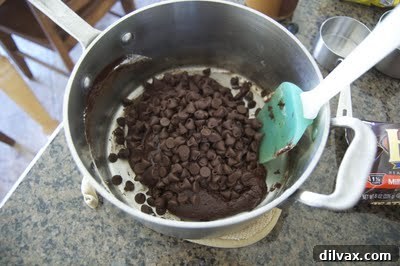 Hand reaching for a bag of toffee chips